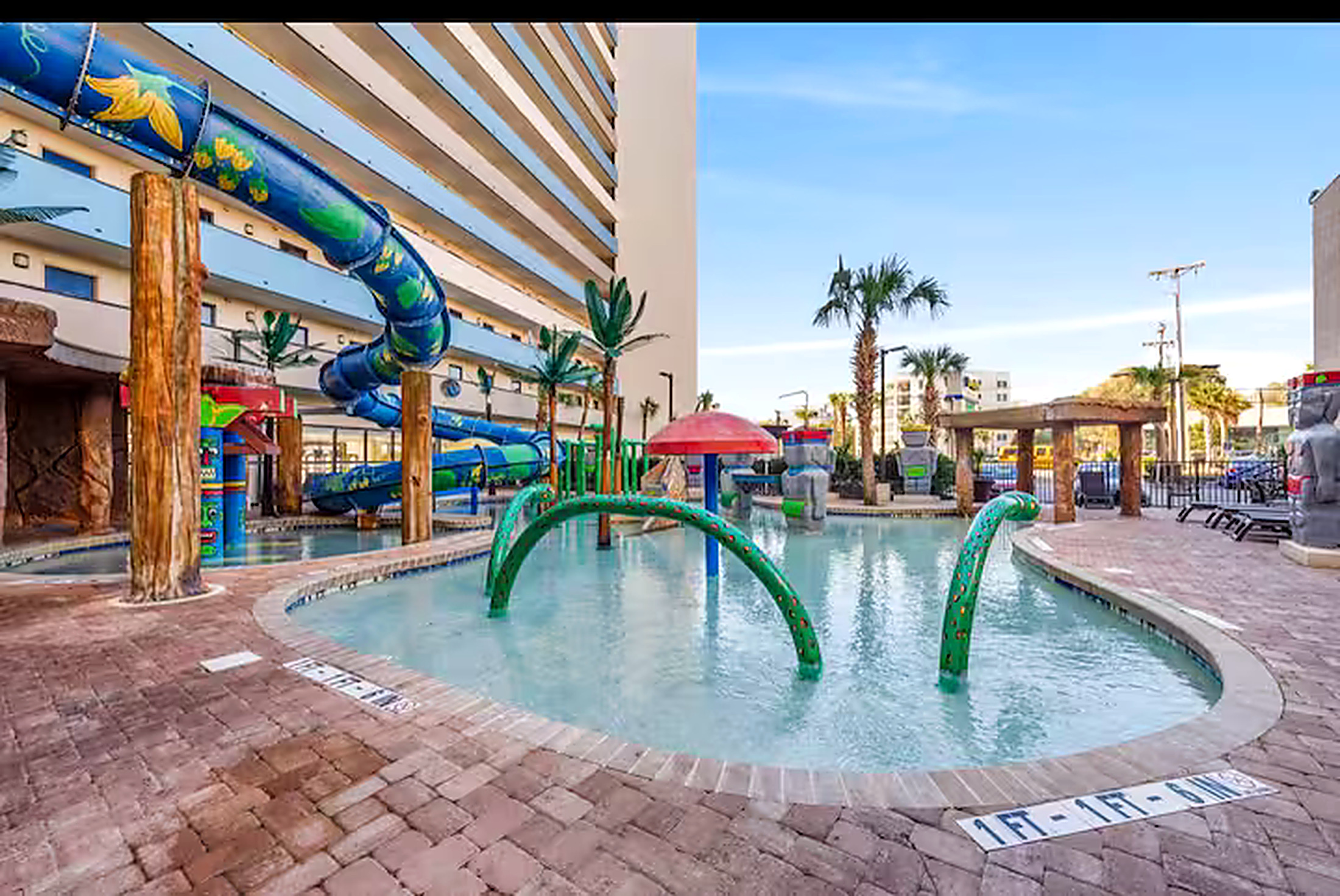 Resort water park with lazy river, waterslide and splash area
